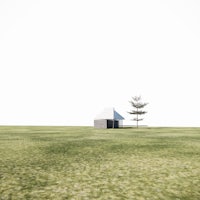 a small house in the middle of a grassy field